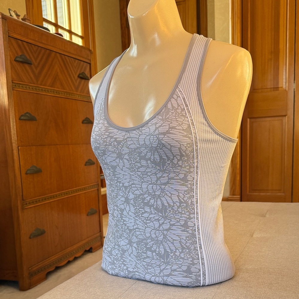 Fabletics Athletic Wear, Racerback Tank Top. Light gray floral pattern.